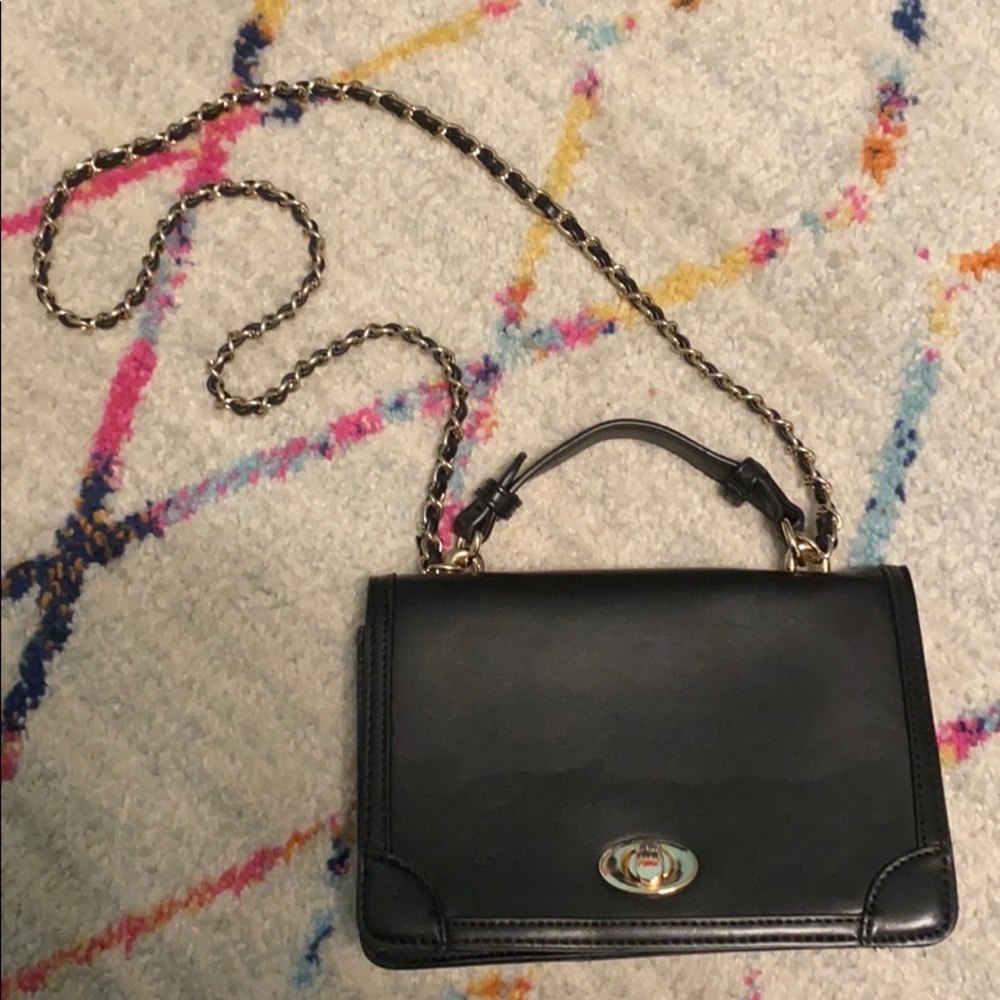 Black purse with gold chain